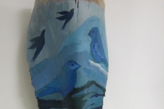 Aviary #15 blue and grey waving stripes are the background for blue and black birds painted on queen palm