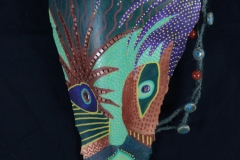 Head of State #17 forest colors, greens blues and brown create a face on queen palm