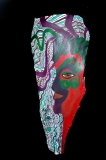 Head of State #2 painted in profile on palm frond with greens, reds, black in face blues and purple in patterns Approx. 28” x 10” x 6”