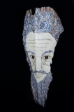 Head of State #5 wise sage face painted on palm frond  shades of black and greys Approx. 29” x 10” x 6