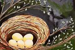 five unhatched eggs in nest, spring leaves on branches